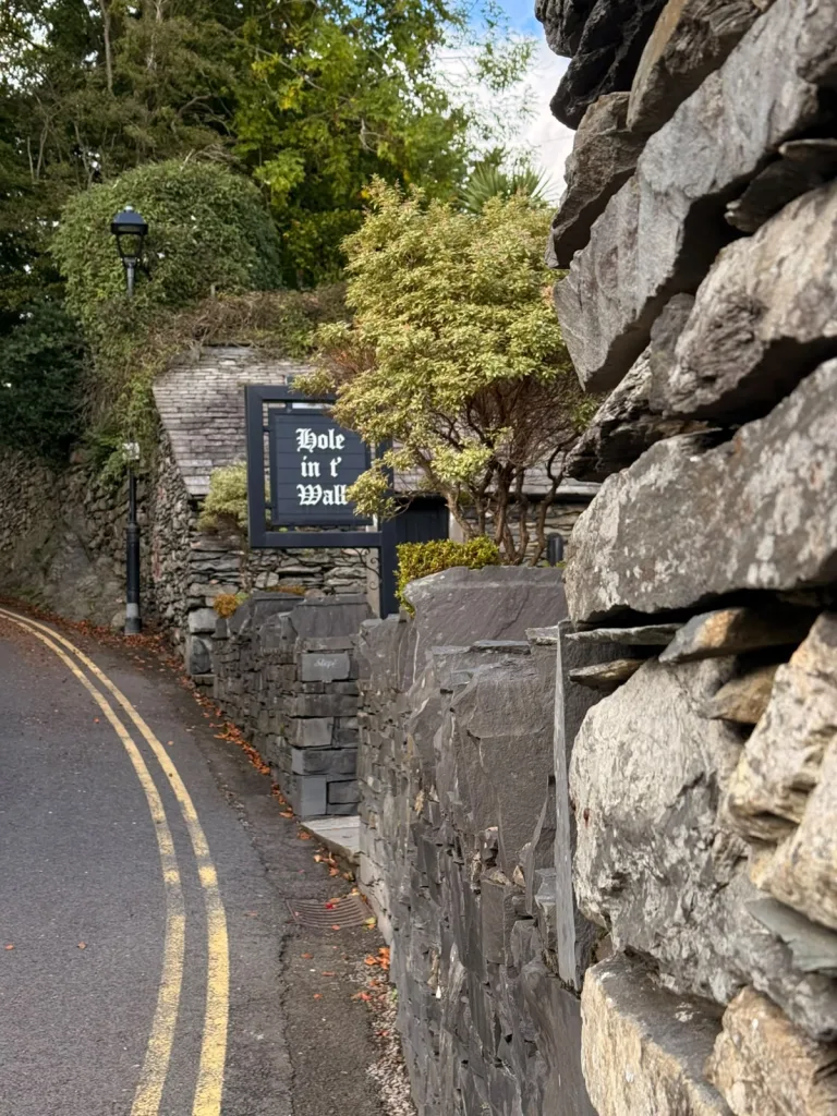 The Hole in t' Wall pub sign on the lane at Lowside, Bowness