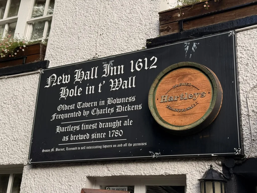 New Hall Inn 1612 sign: oldest tavern in Bowness, frequented by Charles Dickens